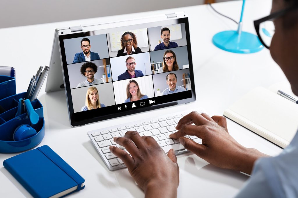 A person on a laptop searching about What is a Virtual Assistant